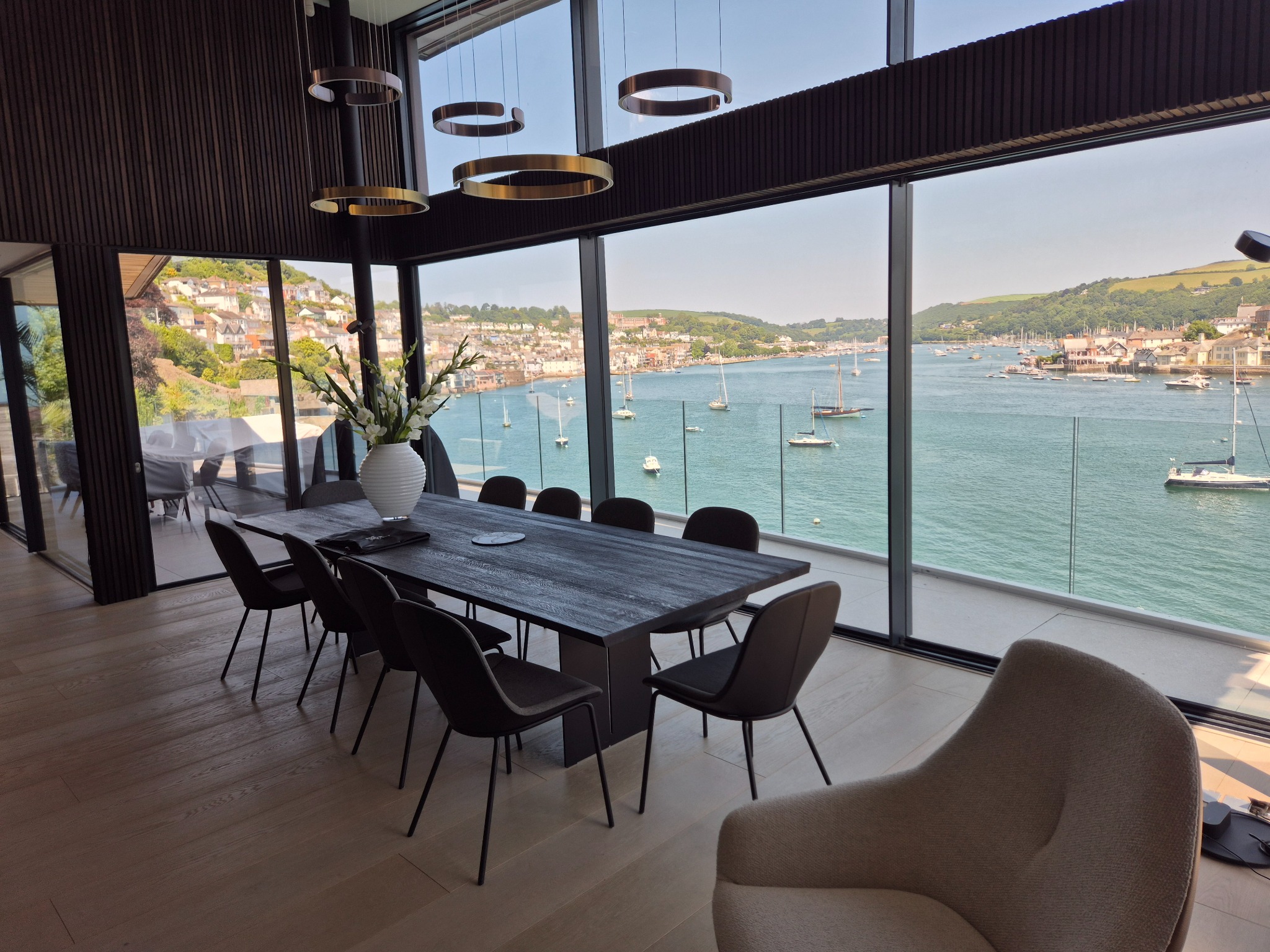 Contemporary dining room overlooking a harbour